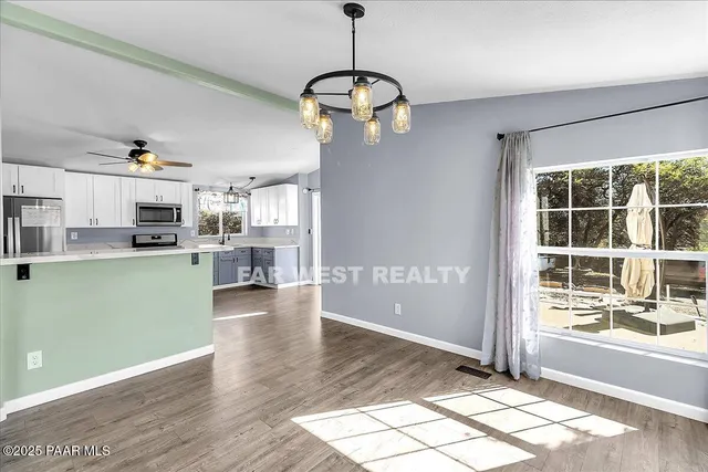 a view of a kitchen and window