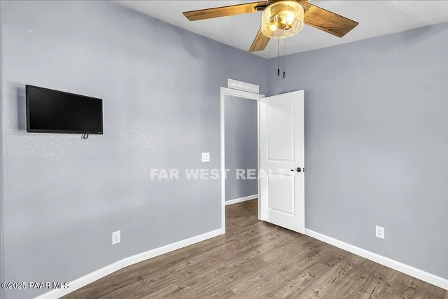 a view of a livingroom with a flat screen tv