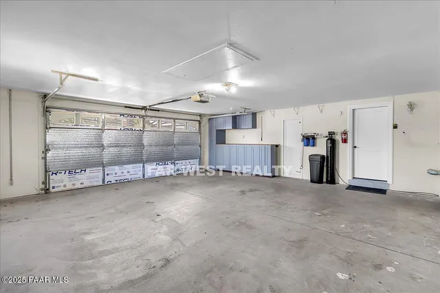 an aerial view of residential houses with city view