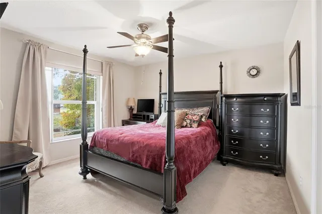 a bed room with a bed and a window