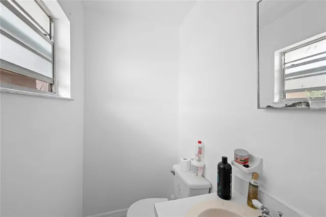 a bathroom with a toilet and a sink