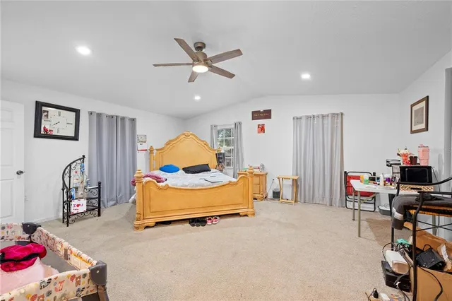 a bedroom with furniture and a wooden floor