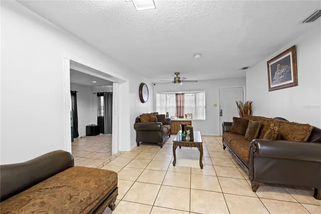 a living room with furniture and a couch