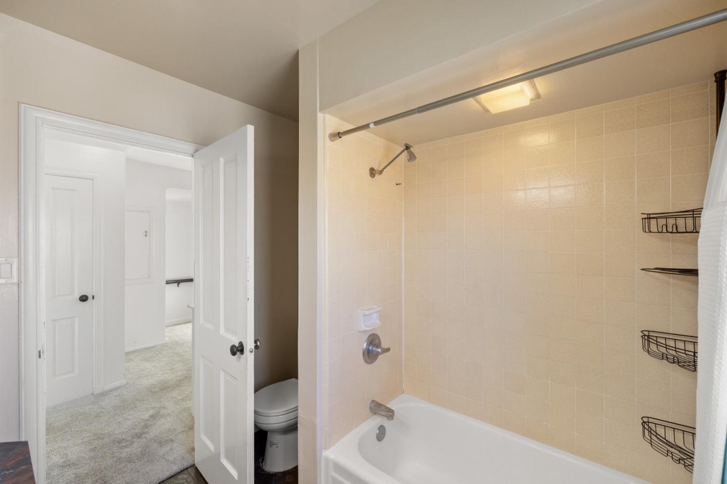 330 Homestead Avenue Salinas, CA 93901 - Photo 19 of 51 a bathroom with a bathtub and a shower