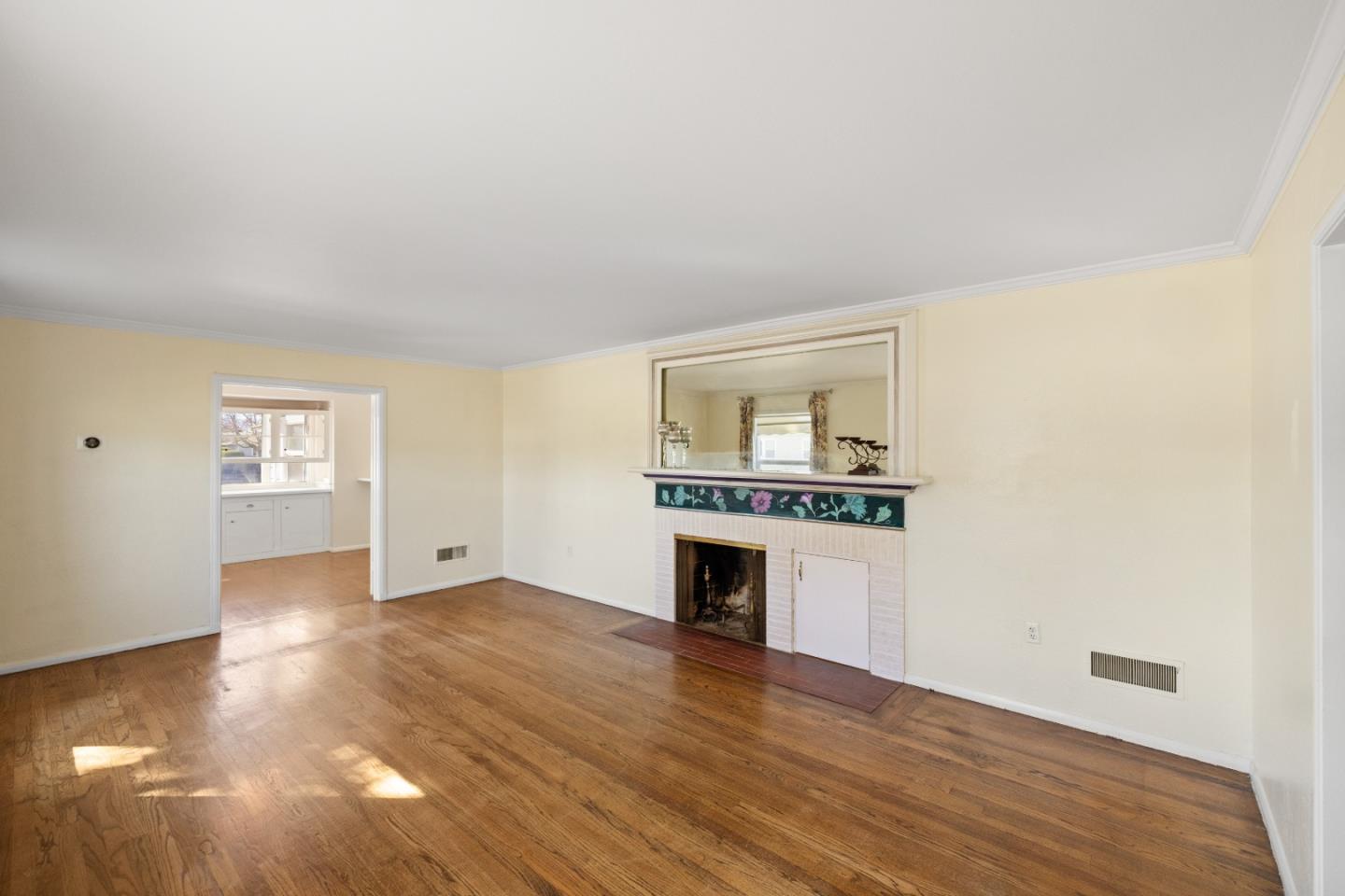330 Homestead Avenue Salinas, CA 93901 - Photo 6 of 51 a view of an empty room with window and wooden floor