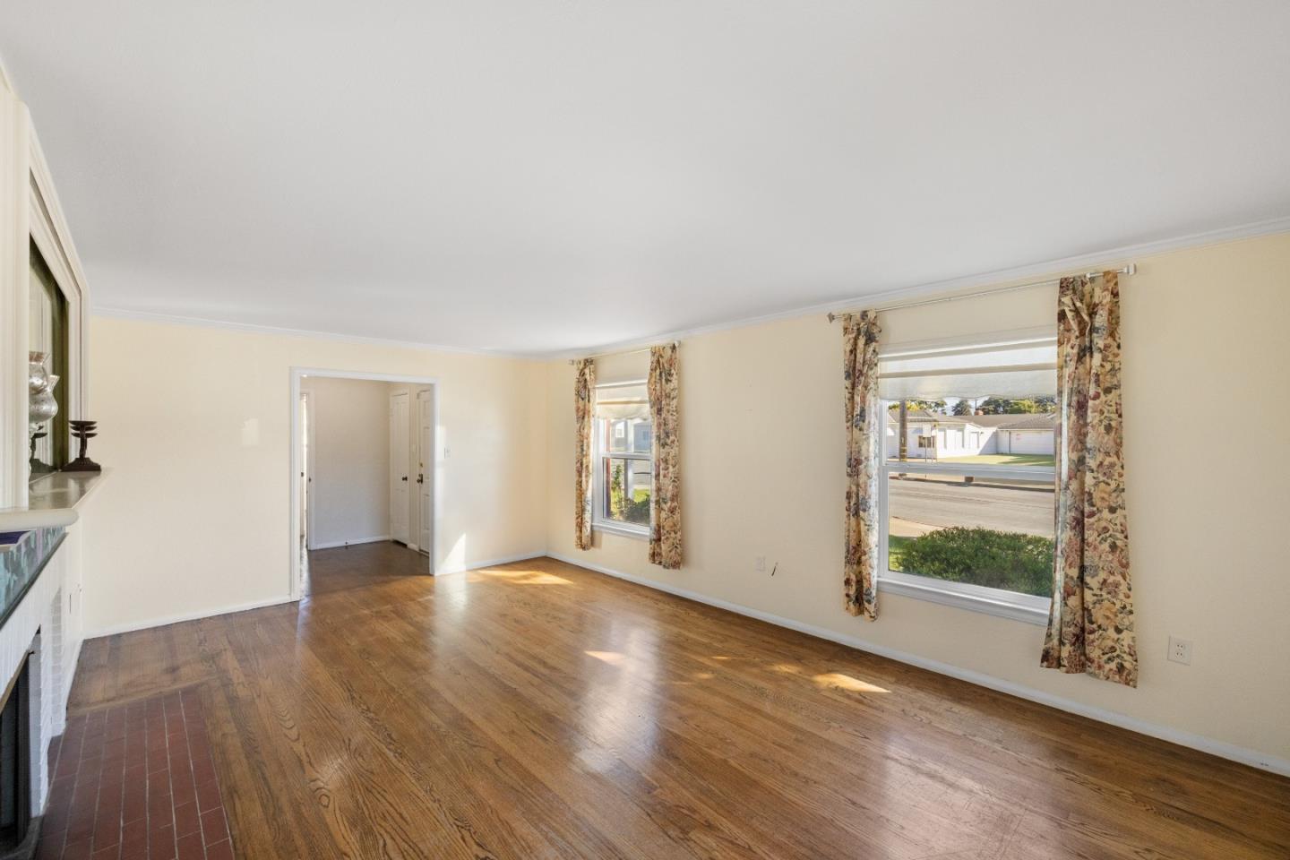 330 Homestead Avenue Salinas, CA 93901 - Photo 7 of 51 a view of an empty room with wooden floor and a window