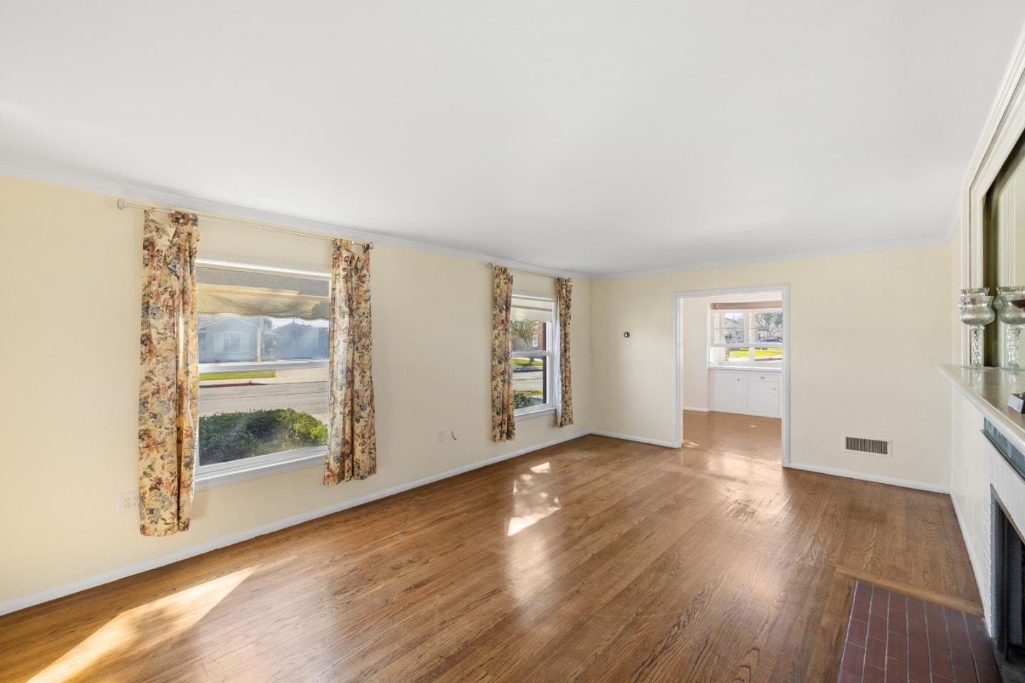 330 Homestead Avenue Salinas, CA 93901 - Photo 8 of 51 a view of an empty room with window and wooden floor