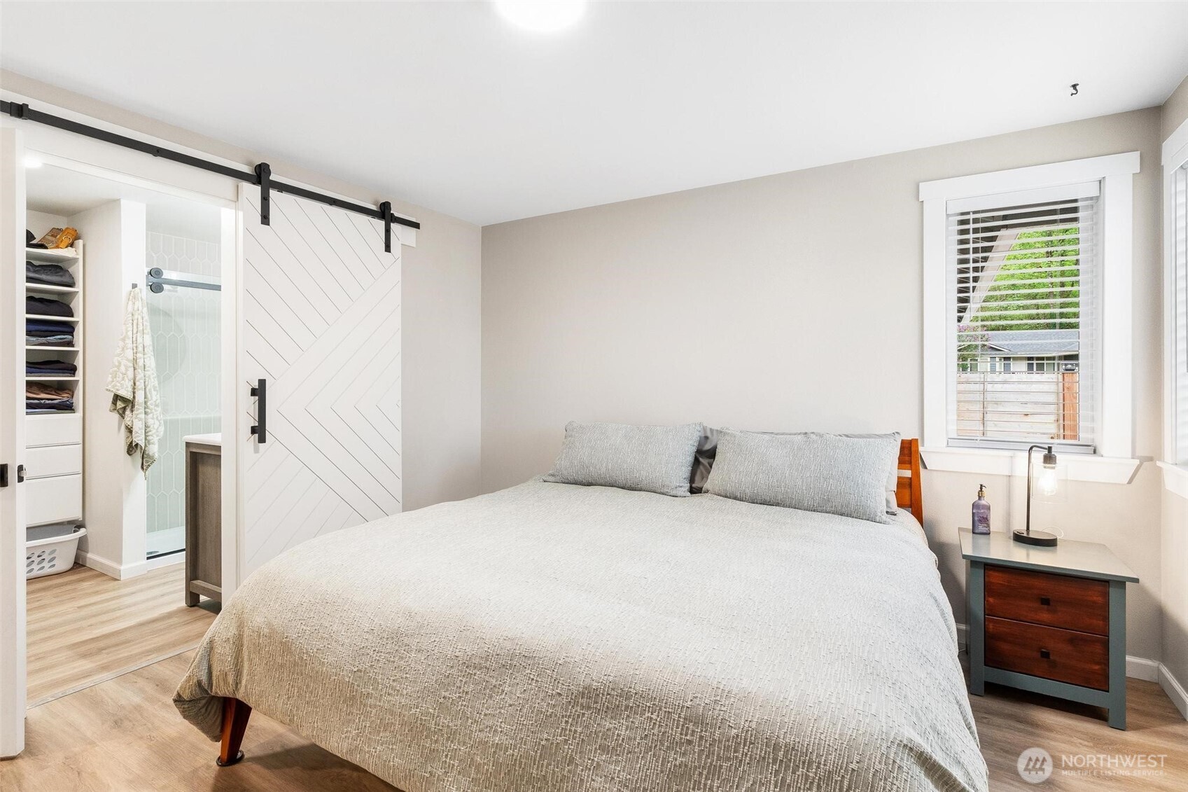 21910 Southeast 239th Street Maple Valley, WA 98038 - Photo 12 of 38 a bedroom with a bed and a window