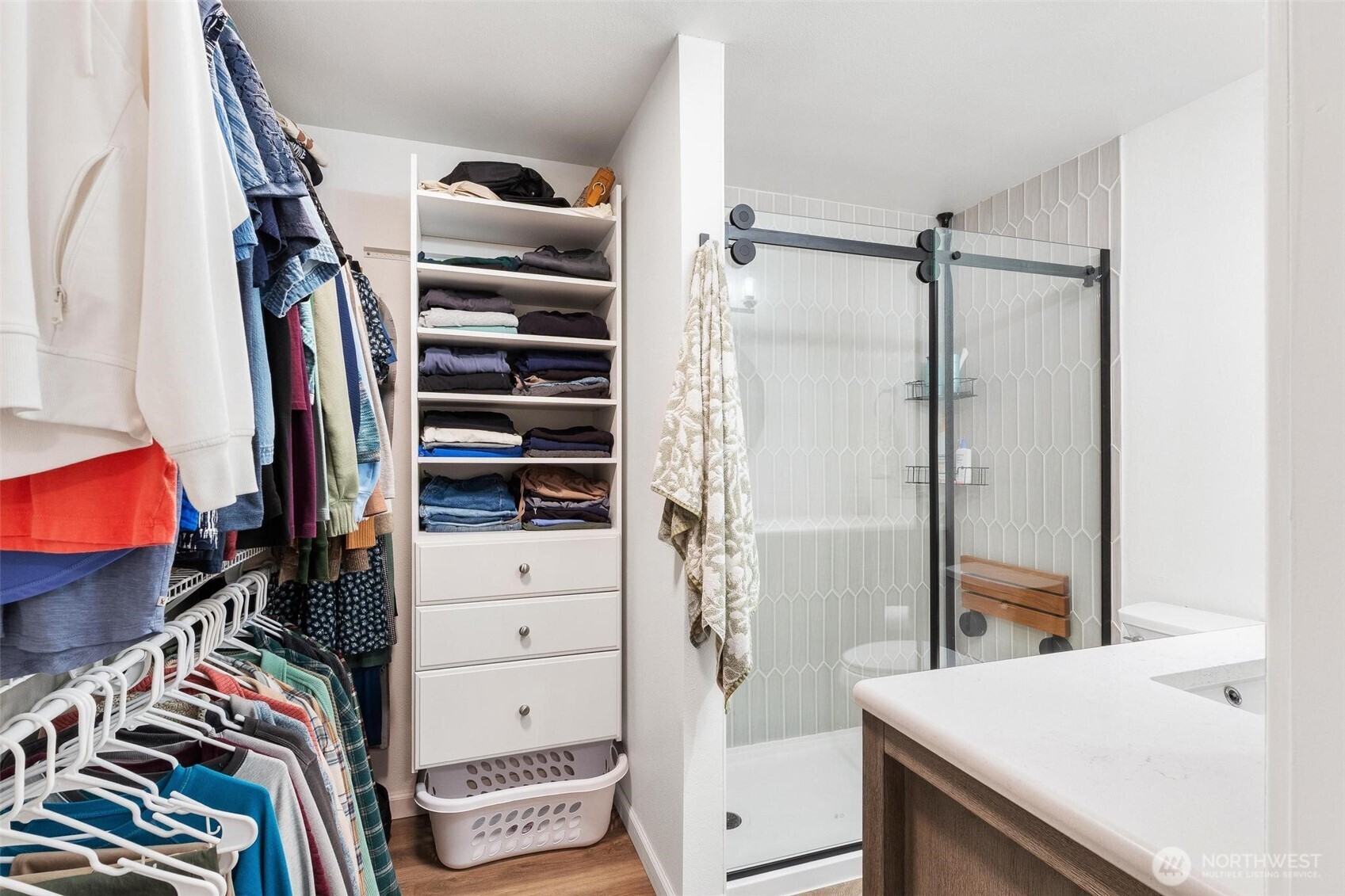 21910 Southeast 239th Street Maple Valley, WA 98038 - Photo 14 of 38 a view of walk in closet with clothes and shoes