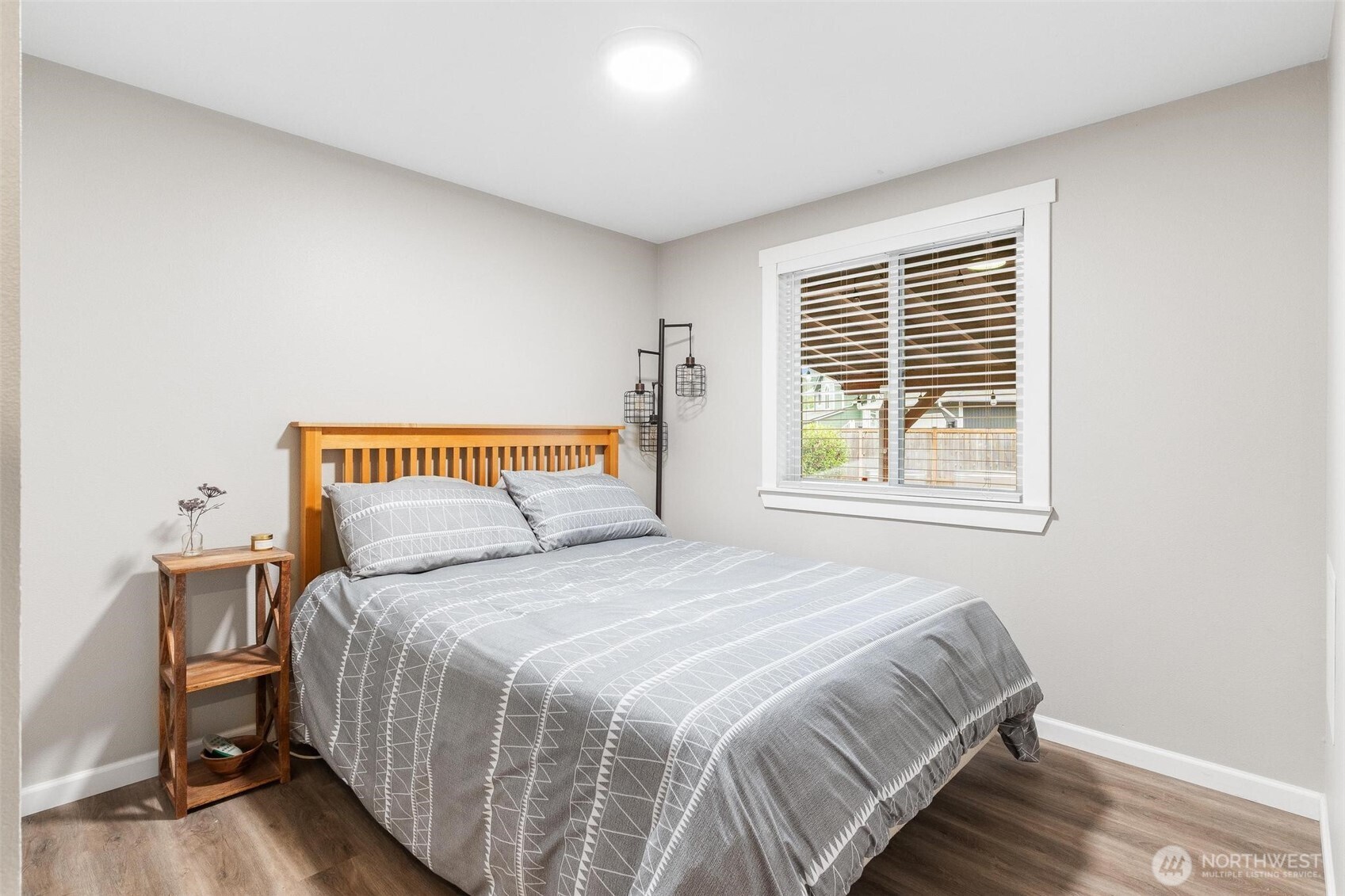 21910 Southeast 239th Street Maple Valley, WA 98038 - Photo 15 of 38 a bedroom with a bed and a window