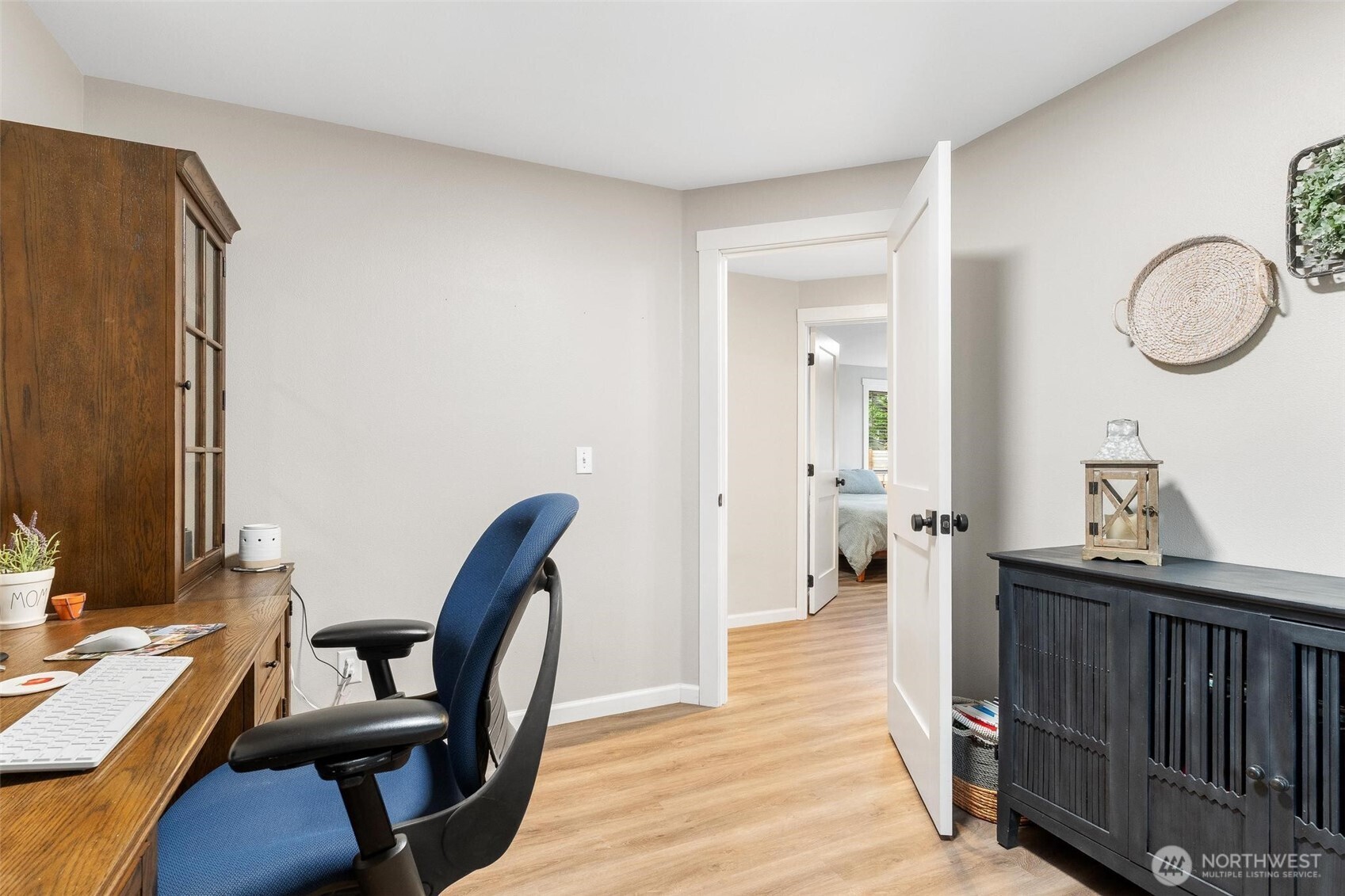 21910 Southeast 239th Street Maple Valley, WA 98038 - Photo 16 of 38 a view of a hallway with furniture and window