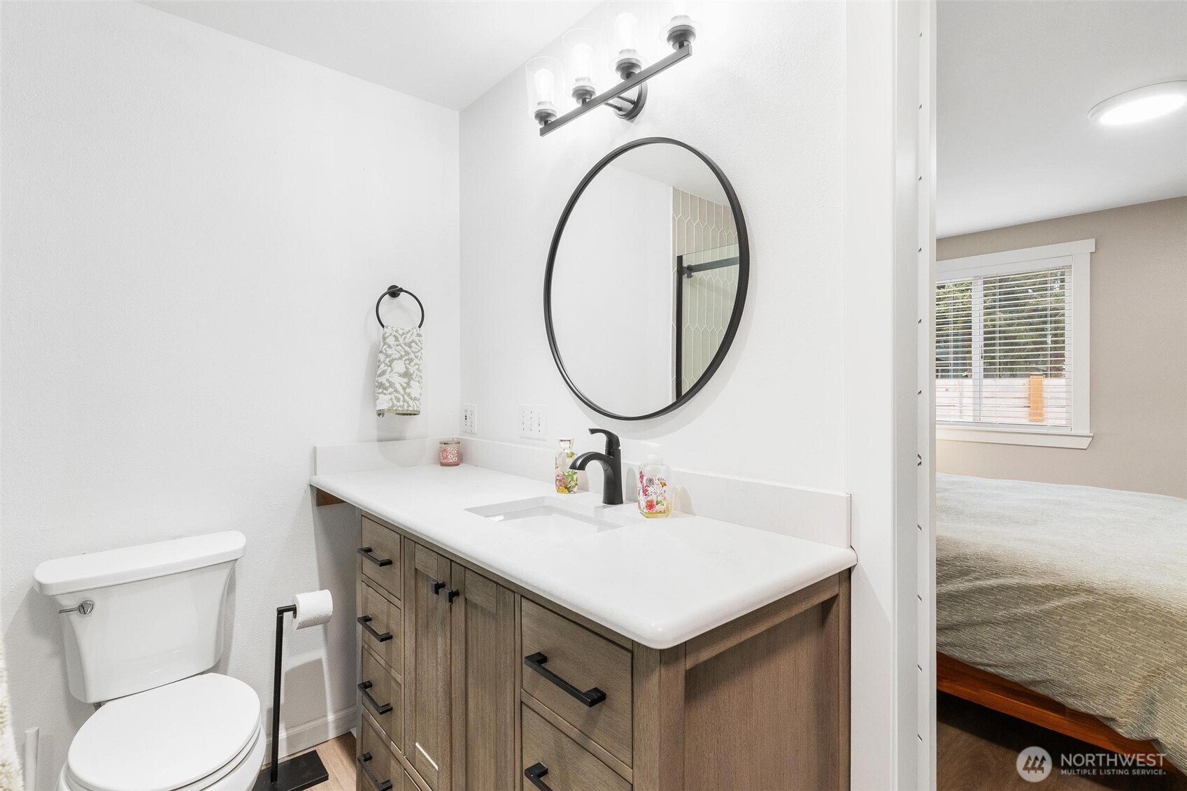 21910 Southeast 239th Street Maple Valley, WA 98038 - Photo 19 of 38 a bathroom with a sink a toilet and a mirror