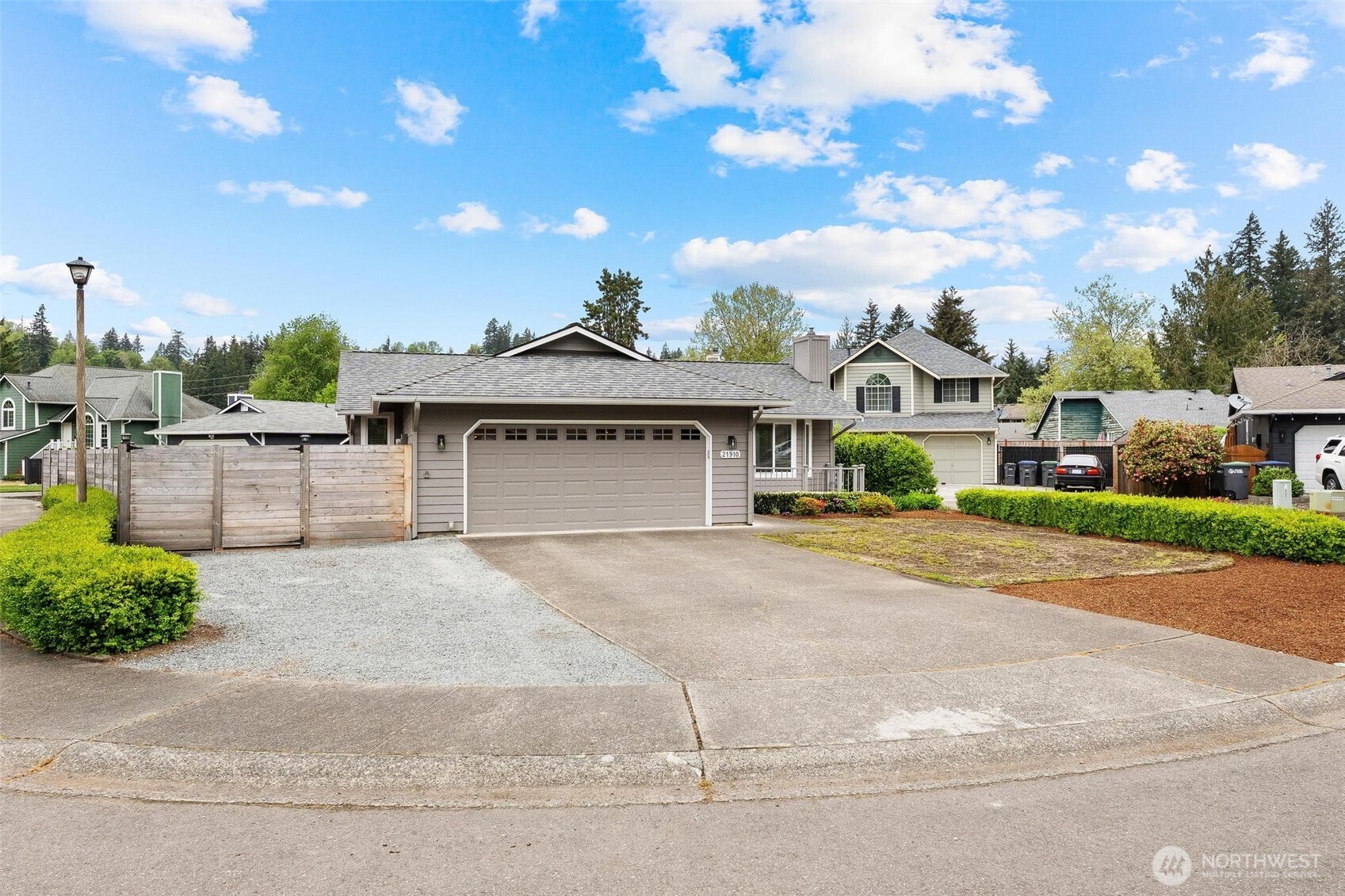 21910 Southeast 239th Street Maple Valley, WA 98038 - Photo 23 of 38 front view of a house with a street