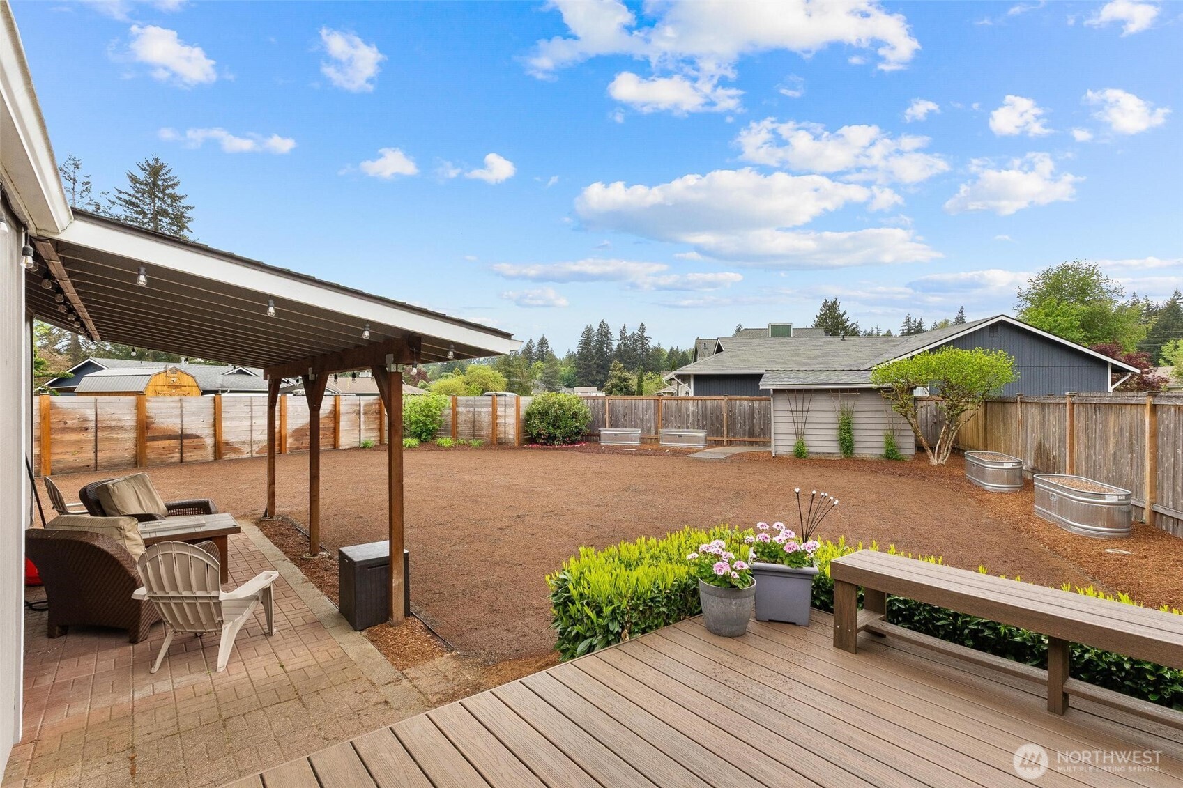 21910 Southeast 239th Street Maple Valley, WA 98038 - Photo 30 of 38 a view of a backyard with sitting area