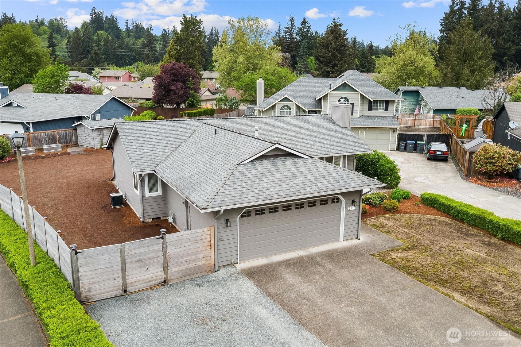 21910 Southeast 239th Street Maple Valley, WA 98038 - Photo 37 of 38 an aerial view of a house with a yard and garage