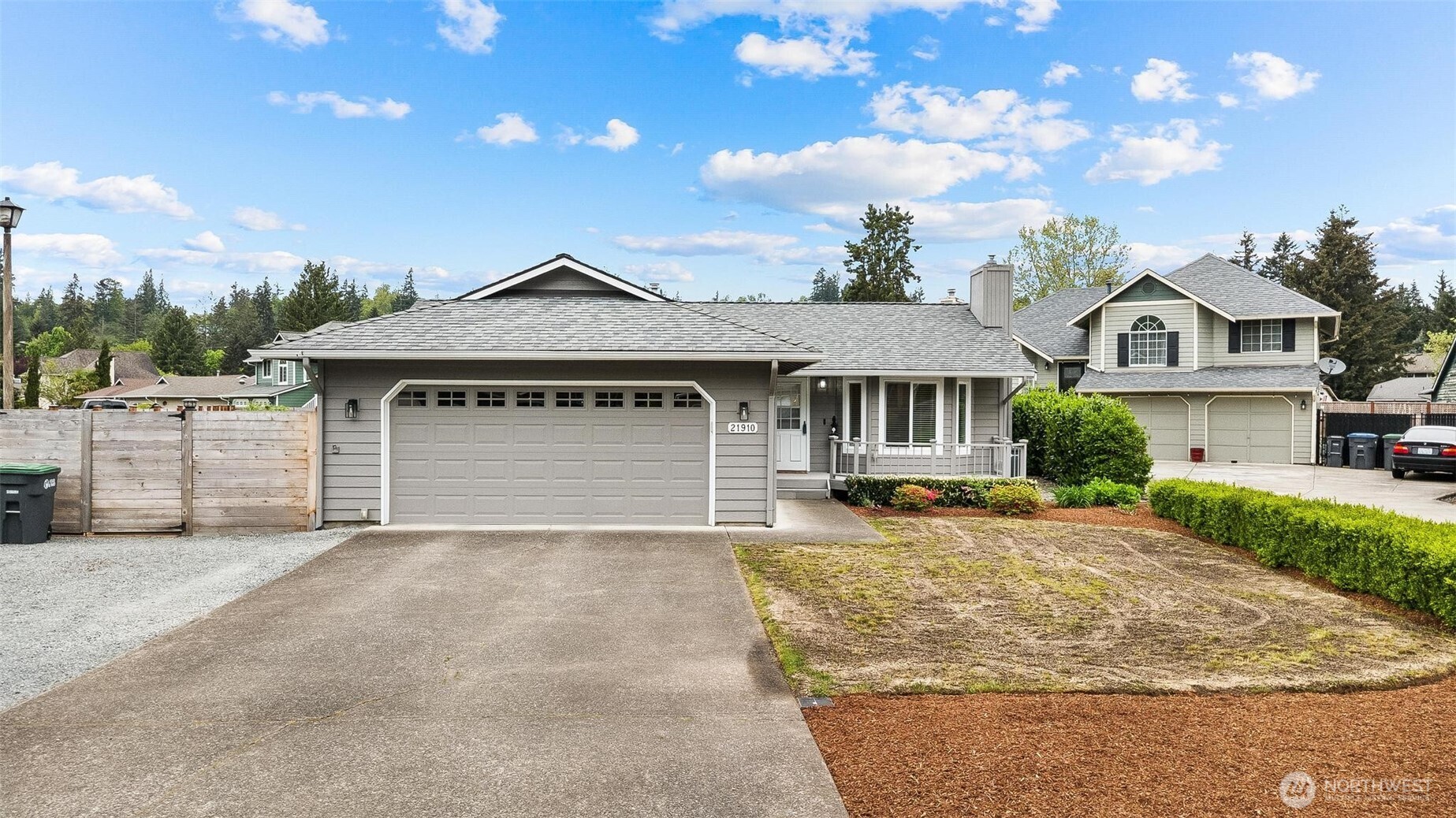 21910 Southeast 239th Street Maple Valley, WA 98038 - Photo 38 of 38 a front view of a house with a yard and garage