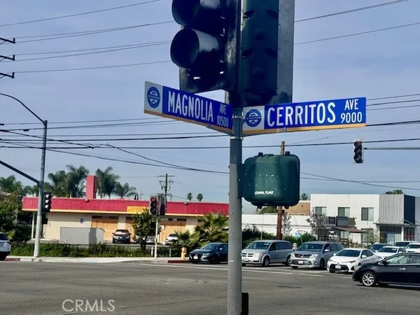 a view of a building with traffic signal lights