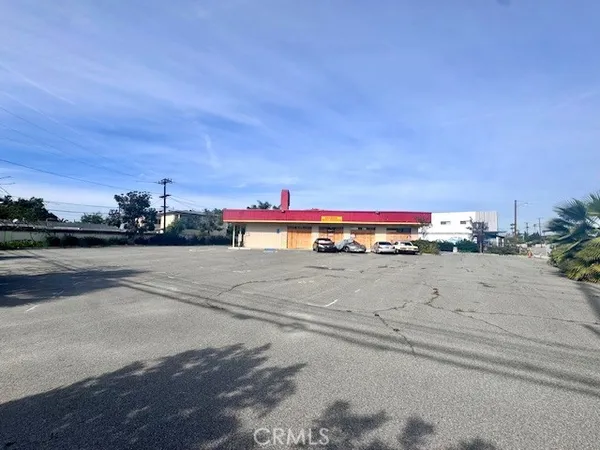 a view of a street with cars on the road
