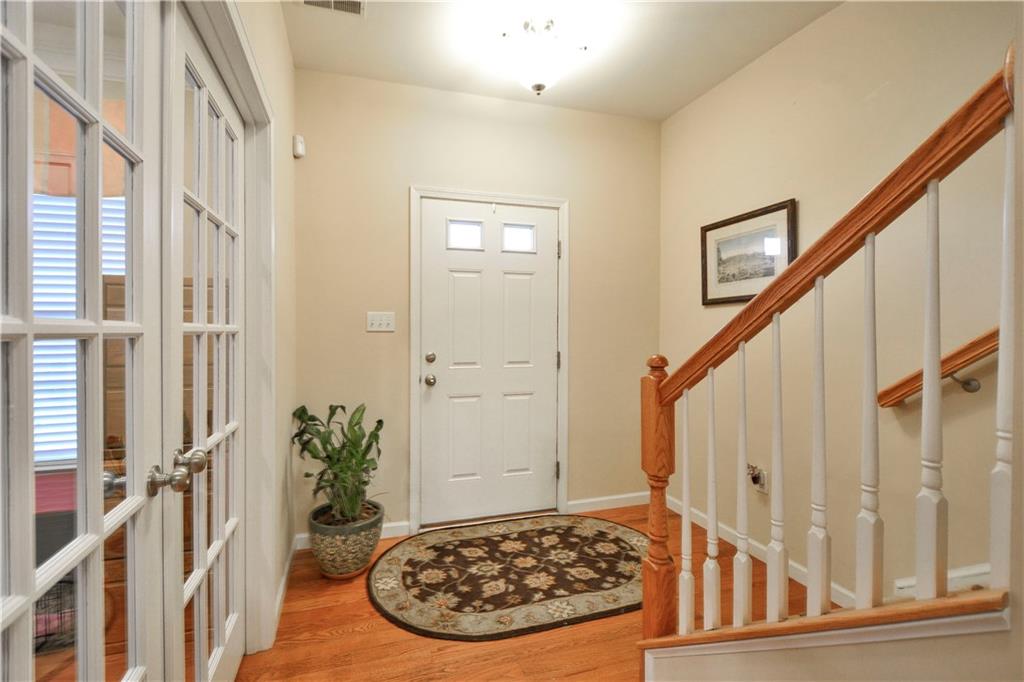 132 Walnut Drive McKees Rocks, PA 15136 - Photo 2 of 25 The front door entry. Oak hardwood floors run through most of the main level - entry, den, hallway, kitchen. To the left are the french doors to the den/office.