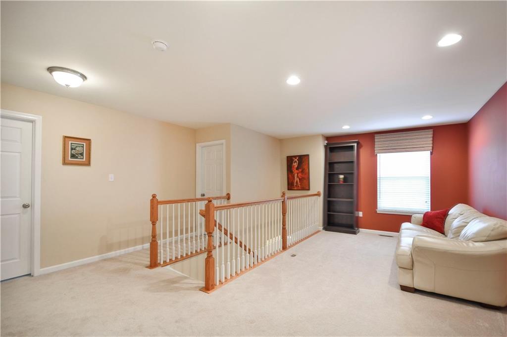 132 Walnut Drive McKees Rocks, PA 15136 - Photo 11 of 25 The upstairs loft is a great space for television, reading, toys or just about any other activity. This area measures approximately 14' from the window to the end of the railing and about 9' from the railing to the wall.