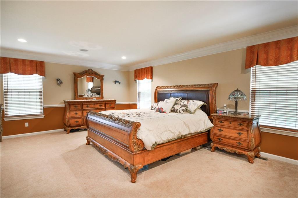 132 Walnut Drive McKees Rocks, PA 15136 - Photo 12 of 25 The master bedroom is a roomy 23'x15'. Elegant crown molding and chair rail. Recessed lights and speakers from the central audio package. The first of two walk-in closets is located on the wall to the left (not pictured).