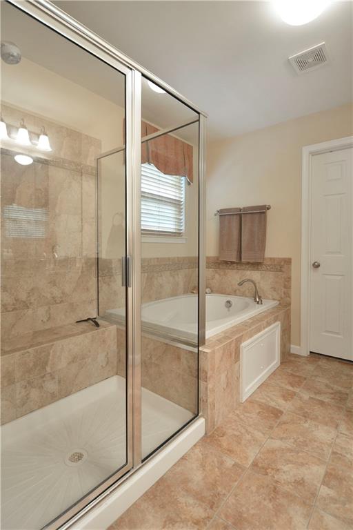 132 Walnut Drive McKees Rocks, PA 15136 - Photo 15 of 25 Tiled shower with seating. Jet tub! The door pictured leads to the second walk-in closet. This closet measures 13'x6'!