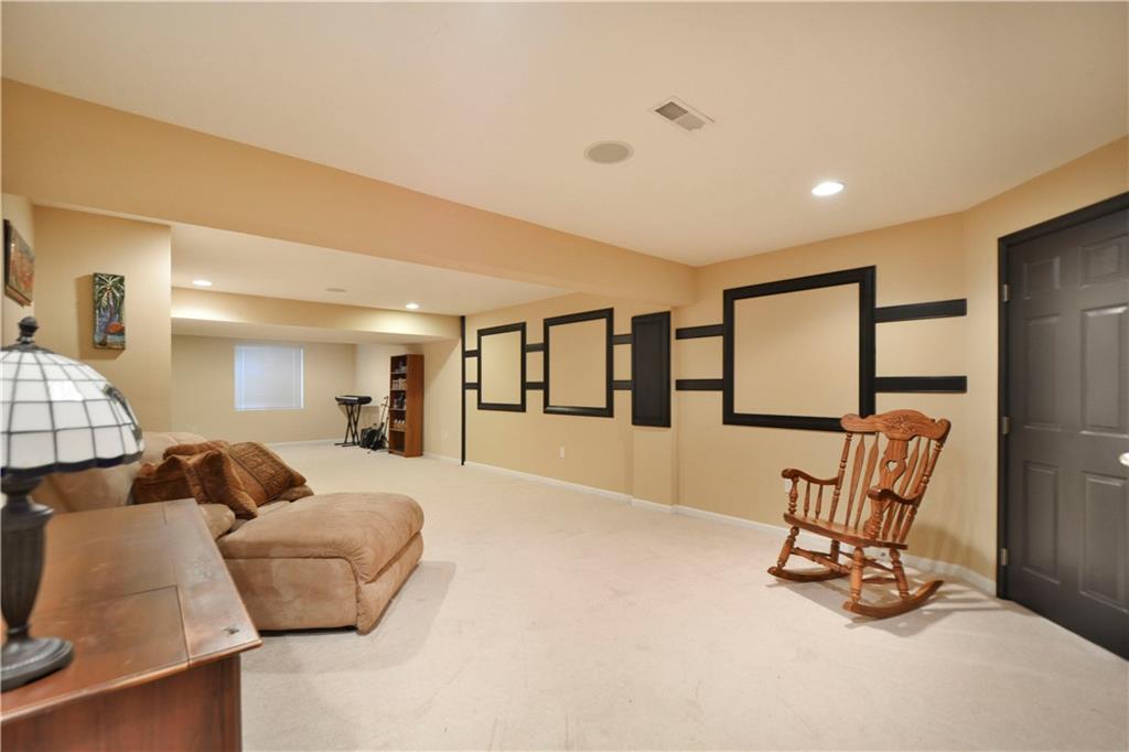132 Walnut Drive McKees Rocks, PA 15136 - Photo 20 of 25 The finished basement/game room! Measures a whopping 40'x 14'! Recessed lighting and speakers! To the back left is an additional storage/utility room, 22'x14'! Measurements approximate.