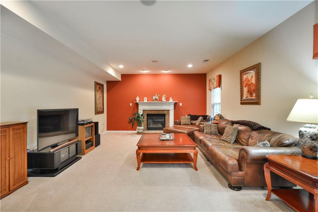 132 Walnut Drive McKees Rocks, PA 15136 - Photo 8 of 25 This living room is larger than it appears! Measures 21' long x 16' wide. The fireplace is gas and comes with accent lights - a great focal point of the room! Two speakers in the ceiling for music or TV audio!