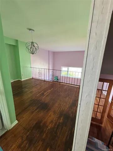 a view of balcony with furniture and window