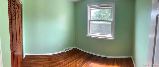 a view of a room that has a window