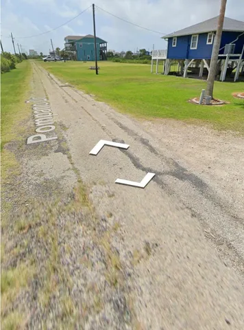 a view of a swimming pool and a yard