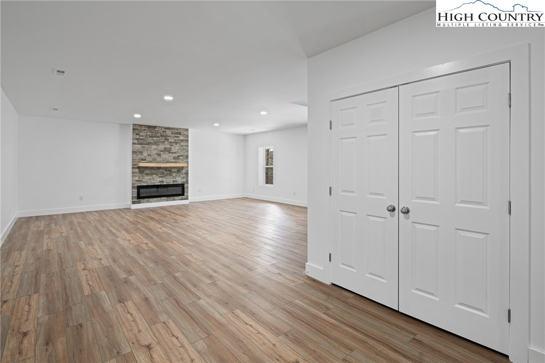 114 Woodpecker Road Purlear, NC 28665 - Photo 26 of 47 a view of empty room with wooden floor