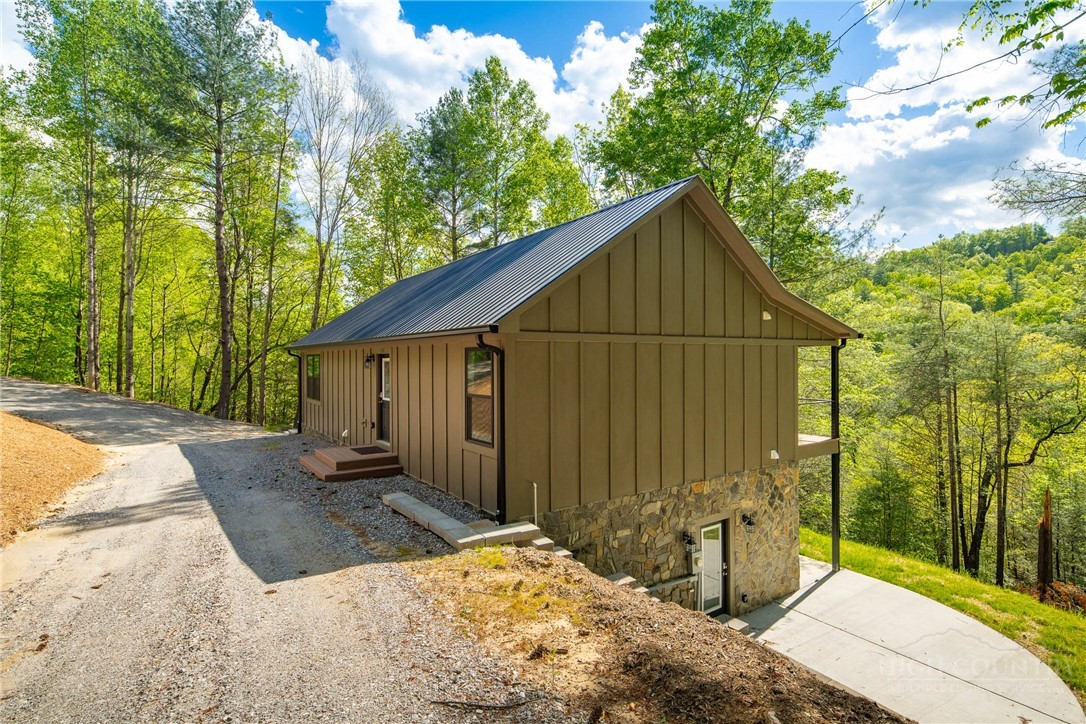 114 Woodpecker Road Purlear, NC 28665 - Photo 32 of 47 a house view with a outdoor space