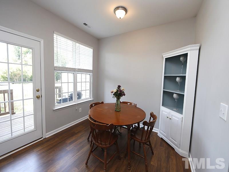 4100 Standing Rock Way Raleigh, NC 27604 - Photo 2 of 11 a view of a dining room with furniture window and wooden floor