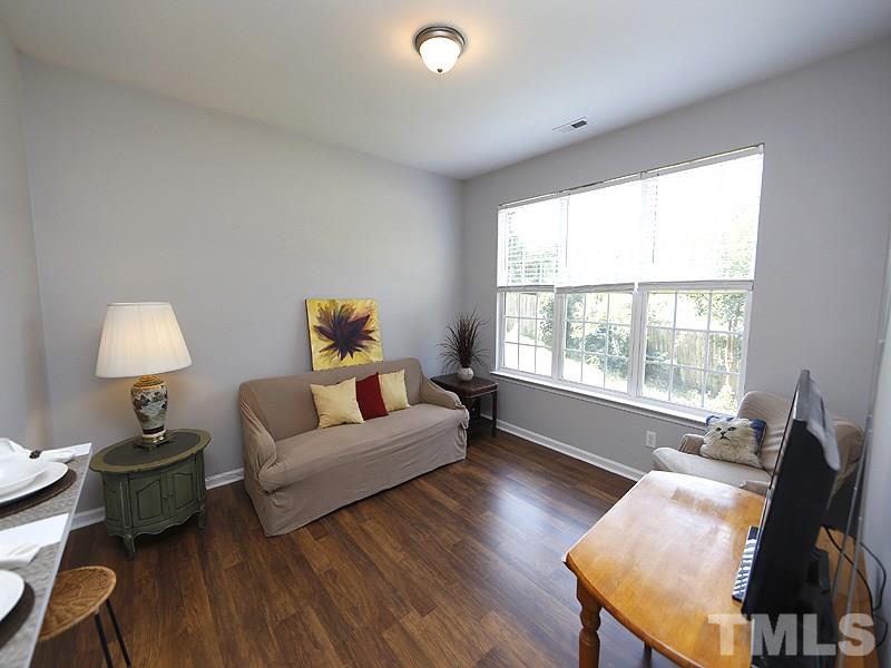 4100 Standing Rock Way Raleigh, NC 27604 - Photo 4 of 11 a living room with furniture and a window
