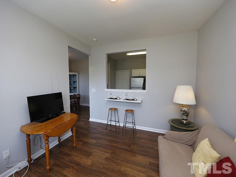 4100 Standing Rock Way Raleigh, NC 27604 - Photo 5 of 11 a living room with furniture and a flat screen tv
