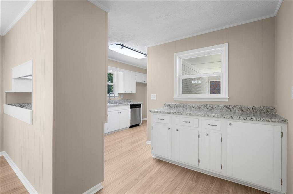 111 Nike Drive Calhoun, GA 30701 - Photo 13 of 36 a bathroom with granite countertop a sink and a mirror