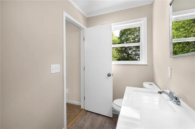 a bathroom with a sink and a window