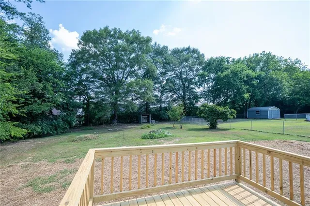 a view of outdoor space with deck and yard