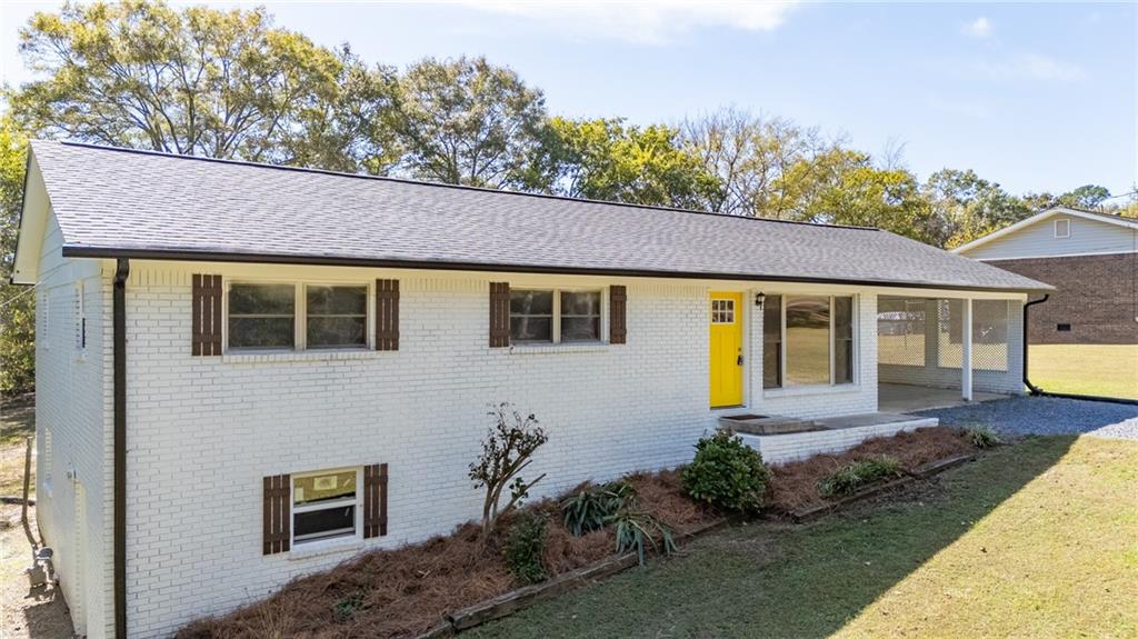 111 Nike Drive Calhoun, GA 30701 - Photo 3 of 36 a front view of a house with garden