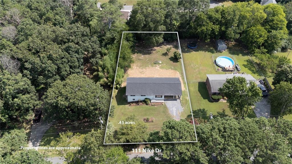 111 Nike Drive Calhoun, GA 30701 - Photo 5 of 36 an aerial view of house with yard swimming pool and outdoor seating
