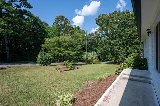 a view of a street with a yard