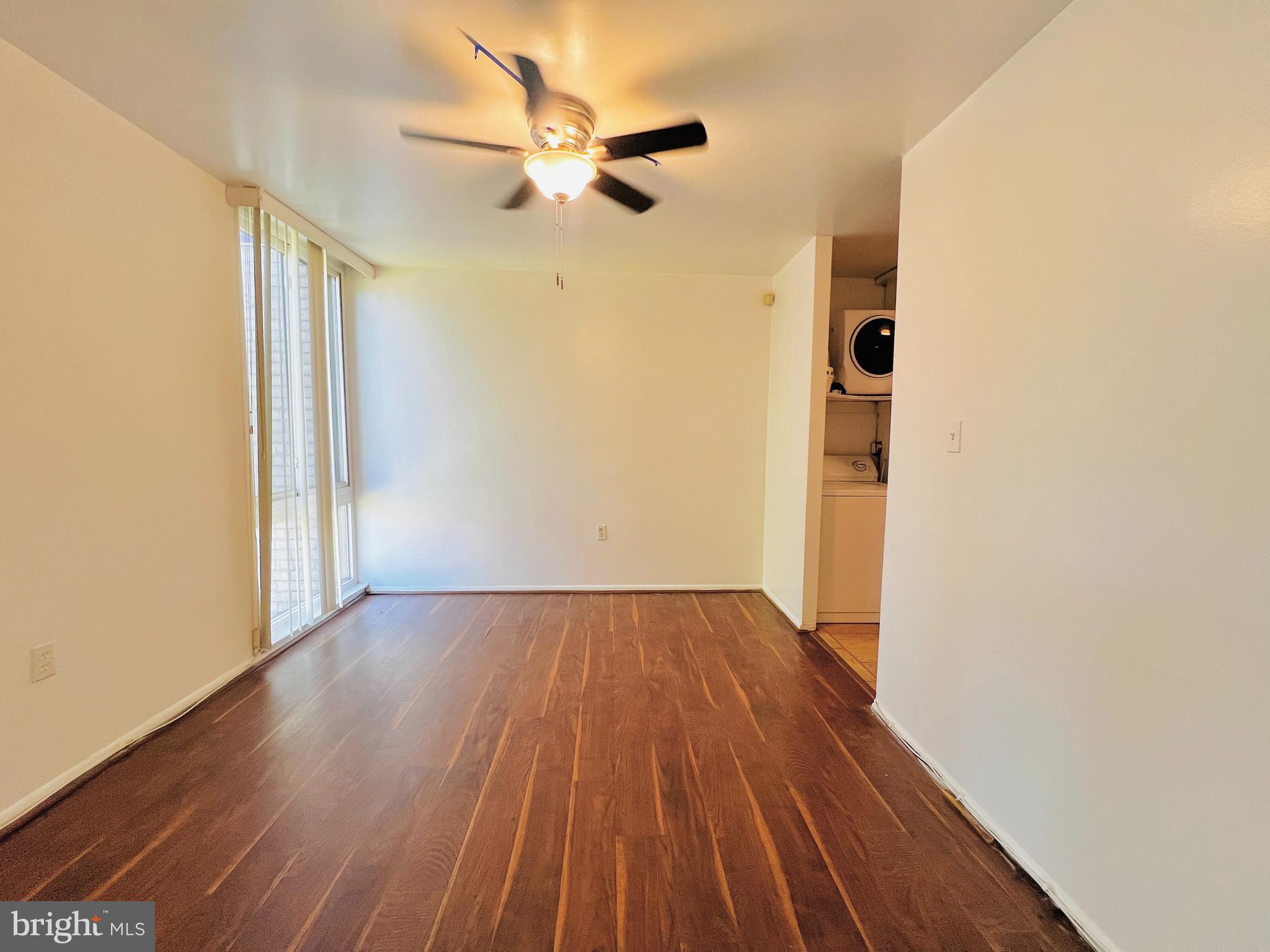8665 Greenbelt Road, Unit 202 Greenbelt, MD 20770 - Photo 14 of 22 a view of an empty room with wooden floor