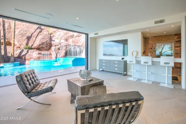 a kitchen with stainless steel appliances granite countertop a sink and a refrigerator