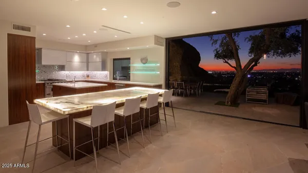 a kitchen with stainless steel appliances a sink and cabinets