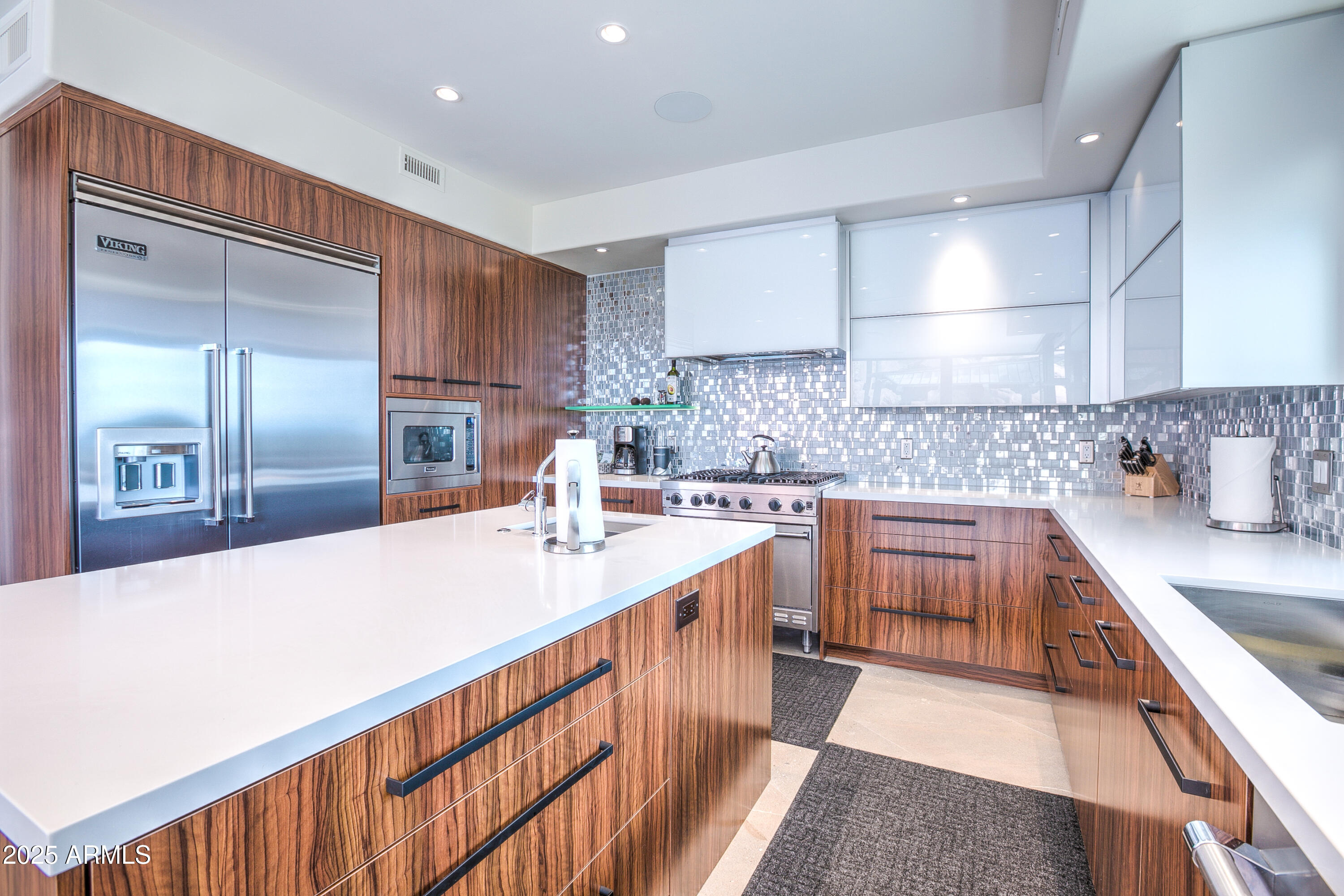 5302 North 47th Street Phoenix, AZ 85018 - Photo 14 of 33 a kitchen with stainless steel appliances a sink and cabinets