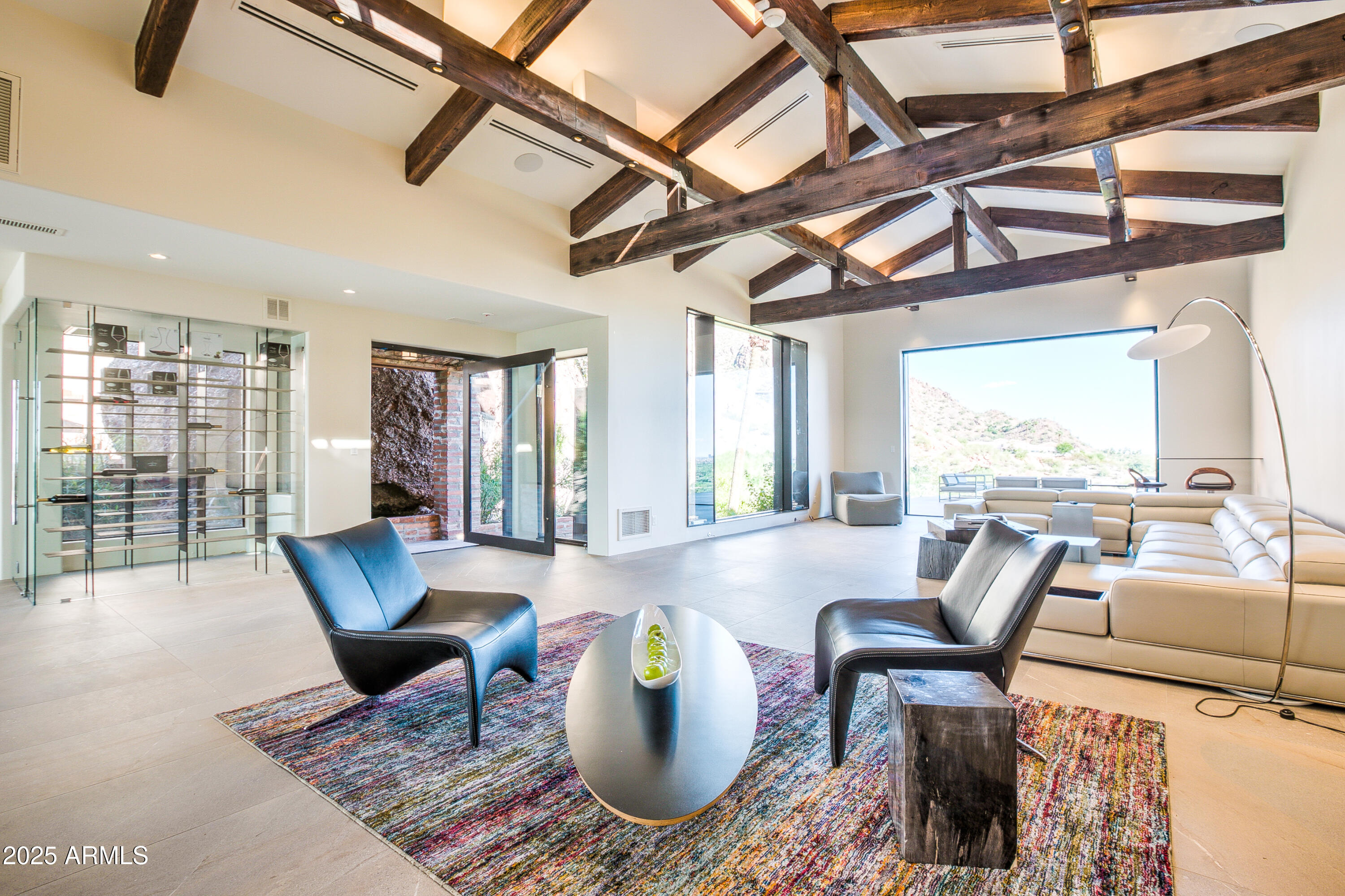 5302 North 47th Street Phoenix, AZ 85018 - Photo 16 of 33 a living room with furniture and a floor to ceiling window