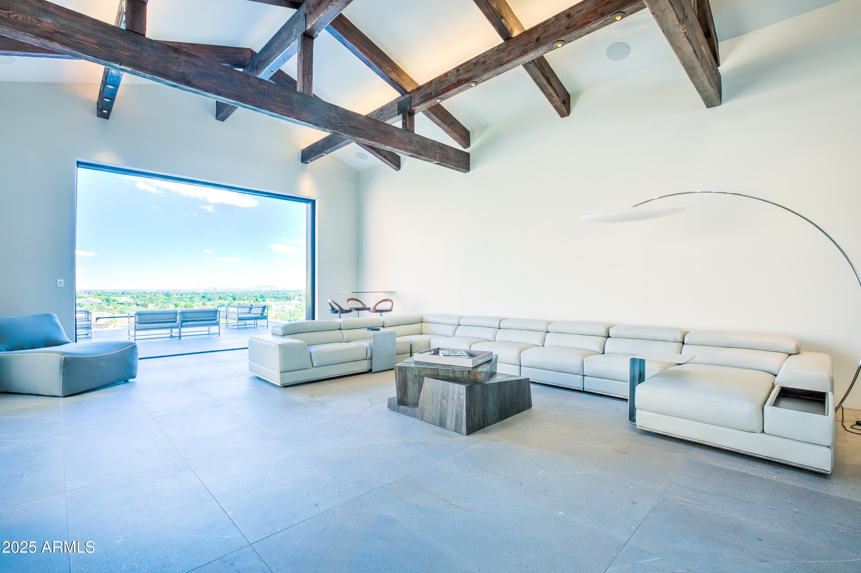 5302 North 47th Street Phoenix, AZ 85018 - Photo 17 of 33 a living room with furniture and a floor to ceiling window