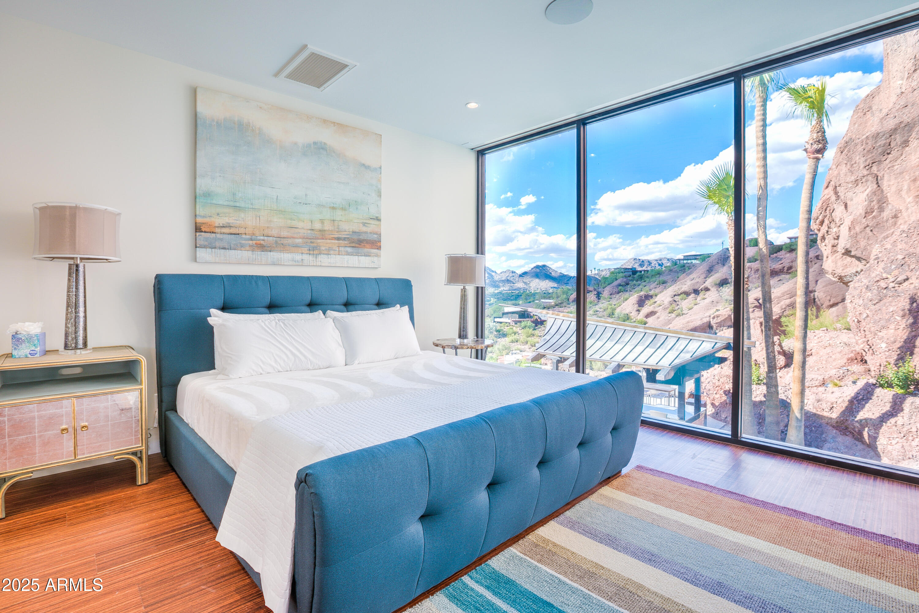 5302 North 47th Street Phoenix, AZ 85018 - Photo 20 of 33 a bedroom with a large bed and a large window