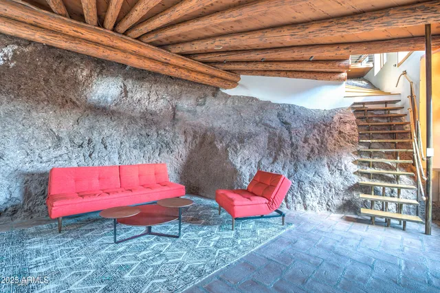 a bedroom with a bed and a fireplace